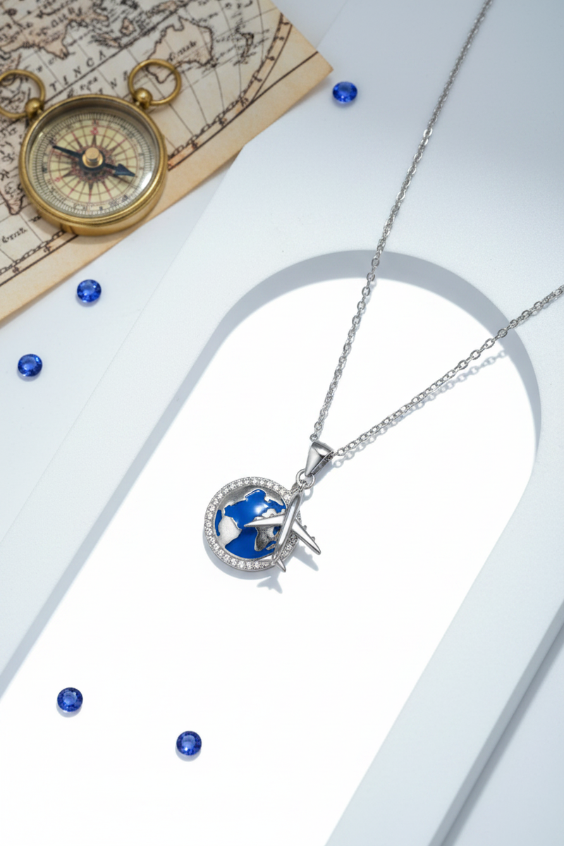 925 Sterling Silver Blue Enamel Globe Airplane Necklace white surface compass world map elegance shoot